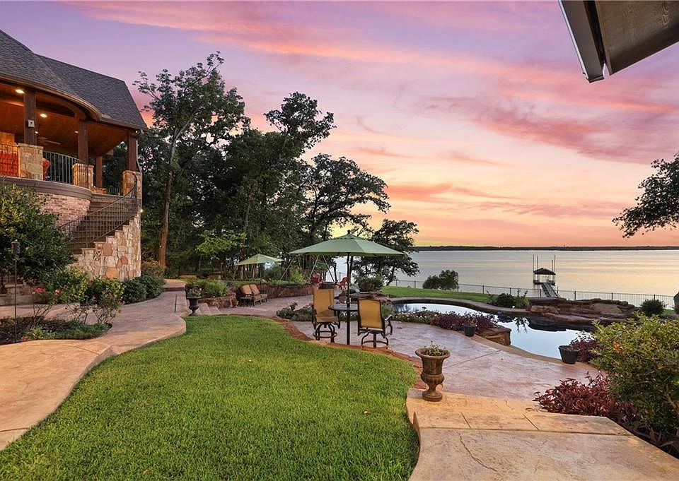 One of only two Flower Mound homes offering a private boat dock on Lake Grapevine with a sandy beach & 20+ mile views!