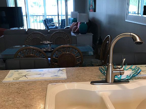 Kitchen looking out to the dining room, living room and lanai