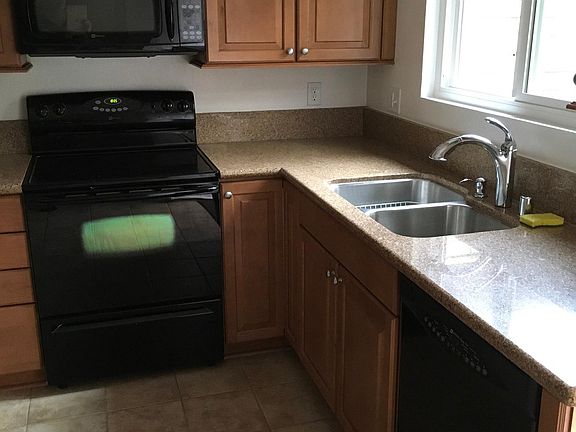 Kitchen window overlooks private patio.