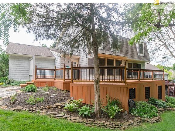 Beautiful landscaping finishes the decks polished look!