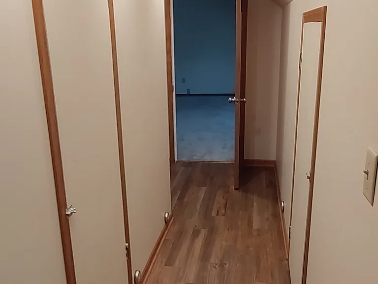 Upstairs hallway to bedrooms and bathroom.