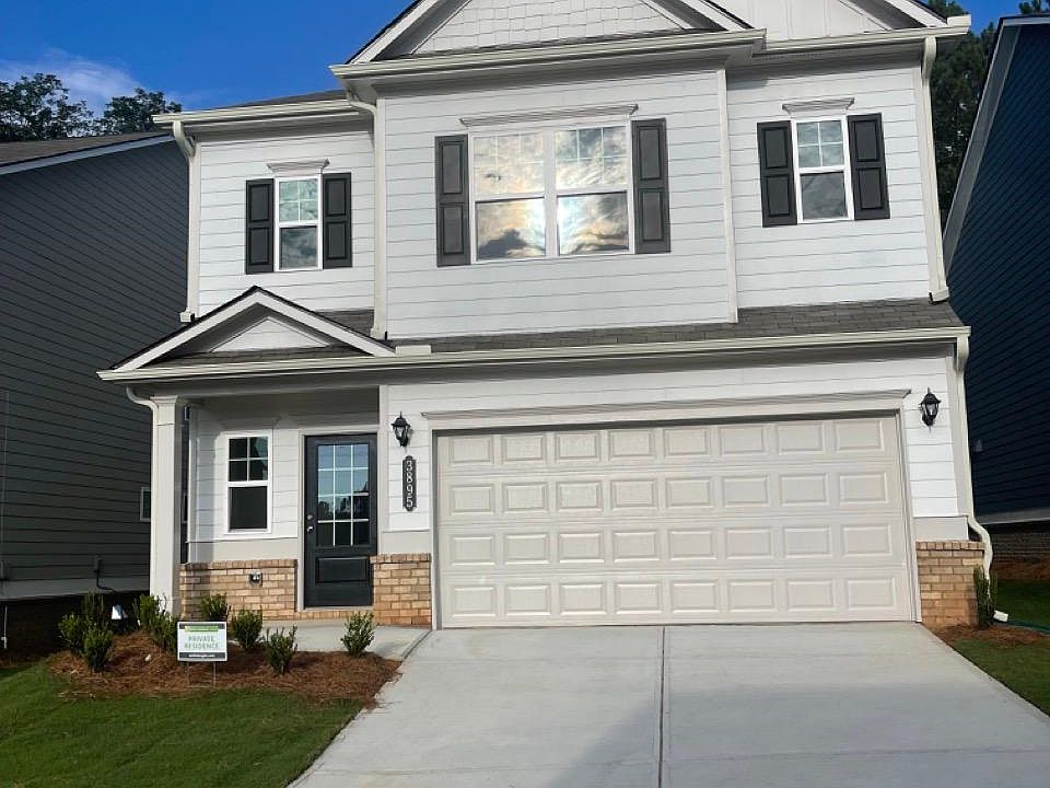 2 car garage with more parking space on the driveway