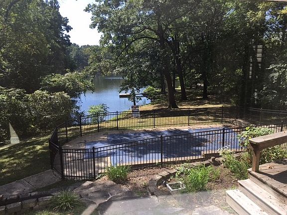 CHECK OUT THE INGROUND POOL WITH SUPER DECK AND GREAT VIEWS OF THE LAKE! 