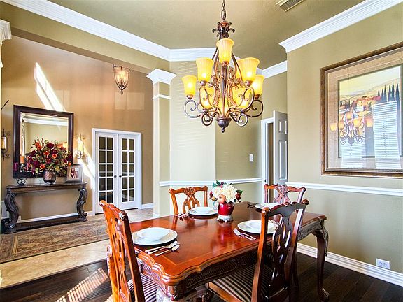 Formal Dining room with Crown Molding and chair rail.