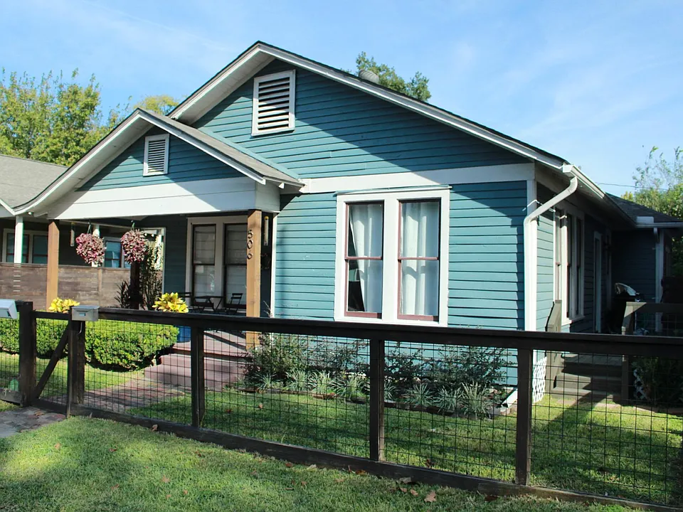 Side deck on south side of home wraps around to back yard. Gas grill stays.