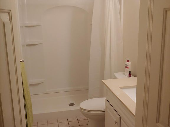 Bath with walk in shower and linen closet