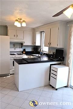sunny and bright kitchen viewed from dining room