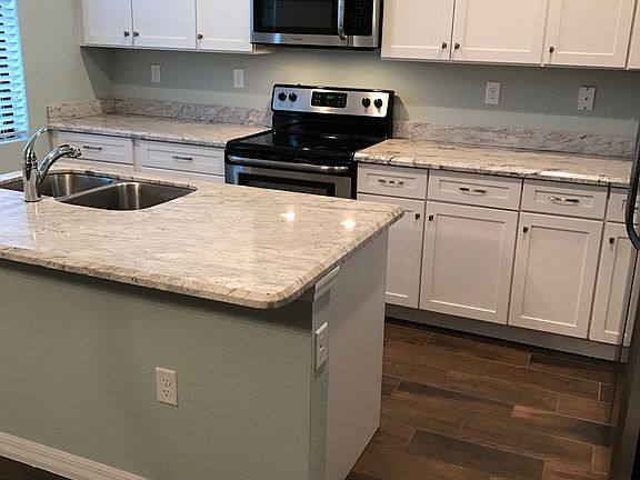 Spacious kitchen with granite countertops