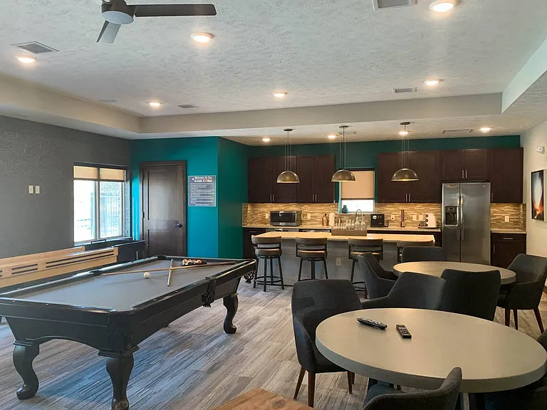 Enjoy a game of pool or shuffleboard with friends in a stylishly designed clubhouse lounge.