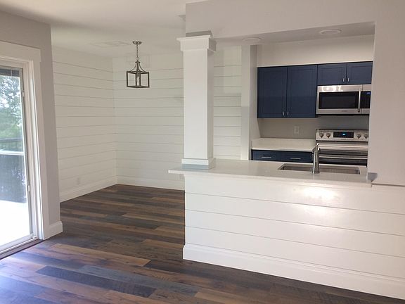 Kitchen & dining areas open to living area and riverfront deck