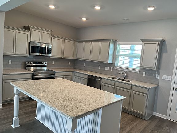 kitchen features are under cabinet lights, staggered cabinets, pantry, S S appliances all 4- piec