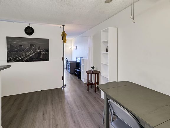 Dining area and view to resident's room behind room dividers