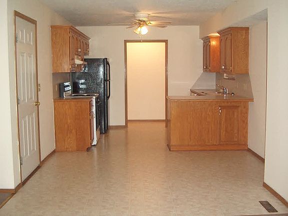 Kitchen w/ Stove, Dishwasher, & Refrigerator