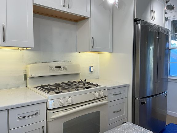 Kitchen is still being completed- subway tile backsplace and stainless microwave over the range to be added in the coming days.