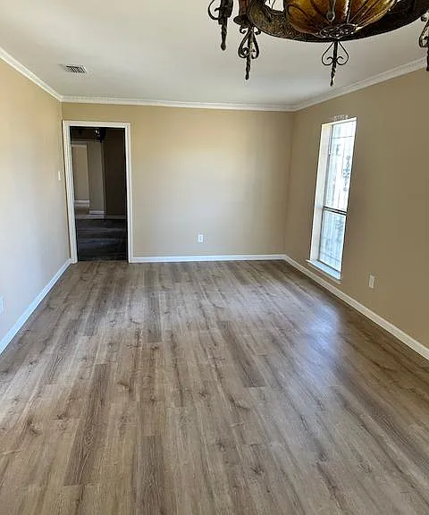 Large formal dining includes space for sitting area/parlour and features ample window light and new Harwood flooring.
