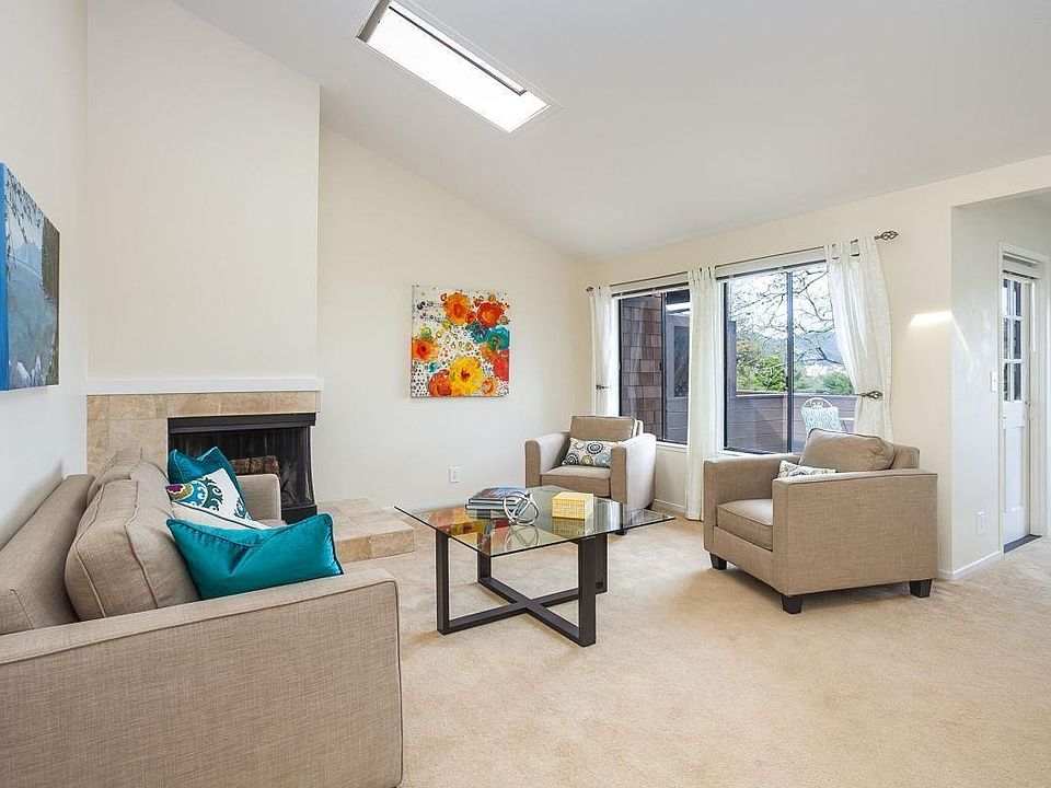 Light filled living room with fireplace