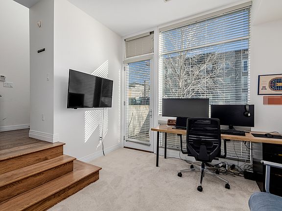 Office/bedroom with barn door and 1/4 bathroom