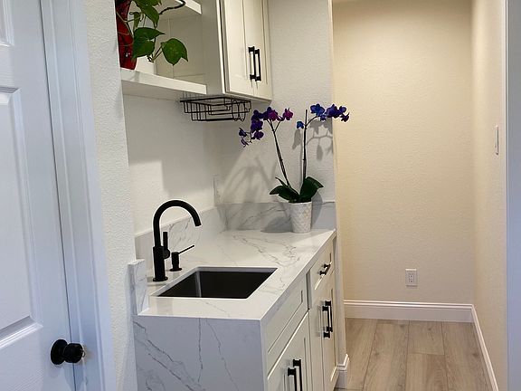 Wet bar and additional open storage.