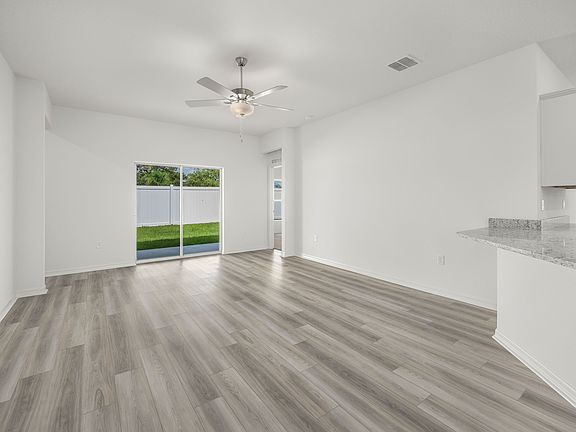 A sliding door in the family room provides a beautiful view of the backyard