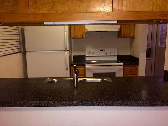 Kitchen located on upper level of unit