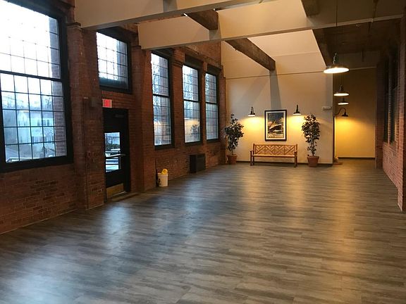 Rear entry to building and rainy day dog run