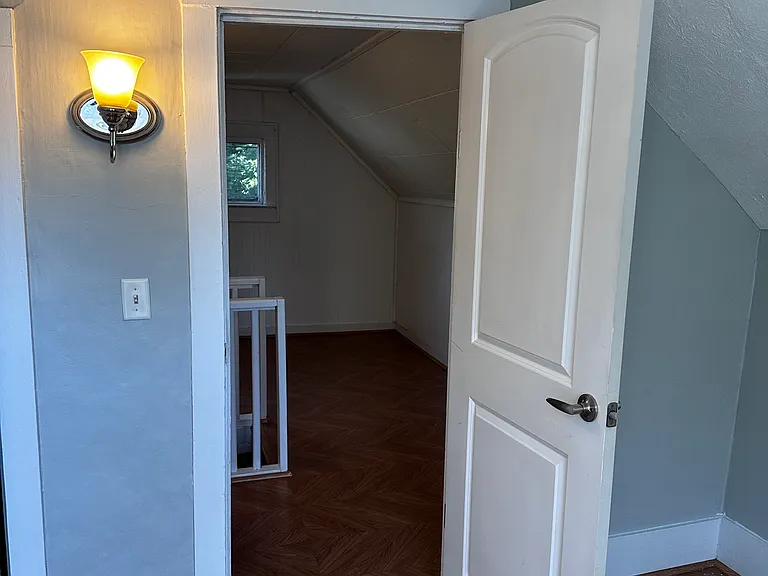 upper bedroom leading to loft