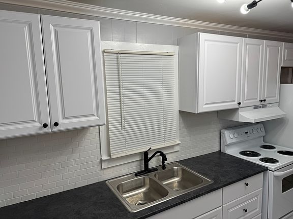 Recently renovated kitchen with ample cabinetry.