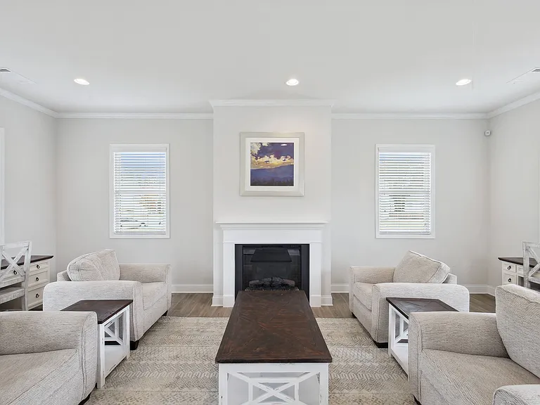 Elegant clubhouse lounge featuring a fireplace.
