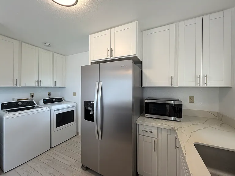brand new, unused refrigerator with ice maker and water dispenser.