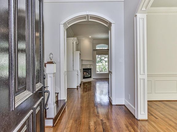 Beautiful front entry with gleaming hardwoods.