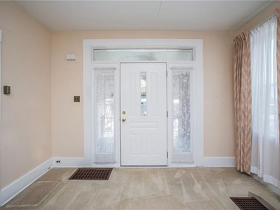 Gorgeous transom window & sidelights flood the room with natural light.