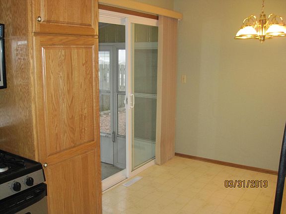 Standing in the kitchen looking at patio door leading out to