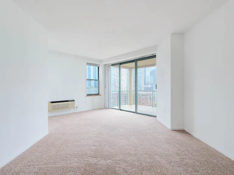 Carpeted Bedroom with Balcony