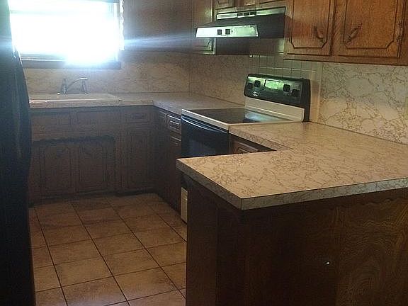Kitchen with tile flooring.
