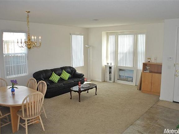 There is a formal dining and living area off to the right as you enter the home.
