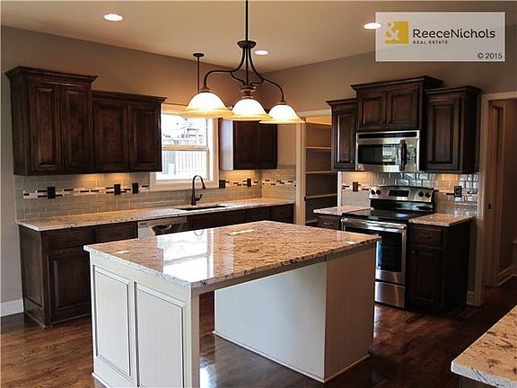 Show Dark Cab Stain theme with White Enamel Island.  Spellerberg is a full custom builder, and you will LOVE working with Billy, he helps you thru the entire process.