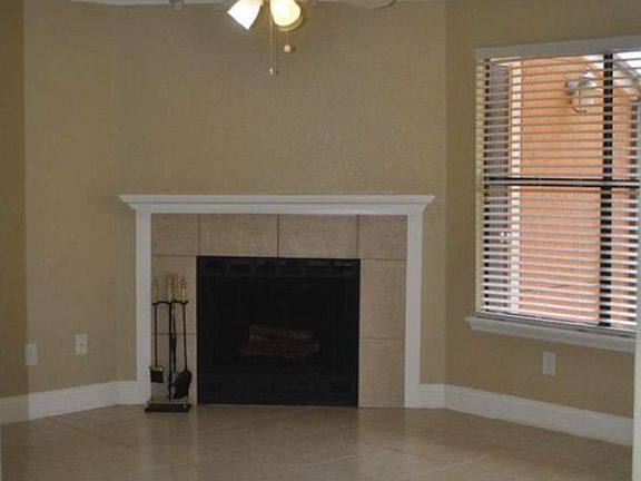 Wood burning fireplace in spacious living room