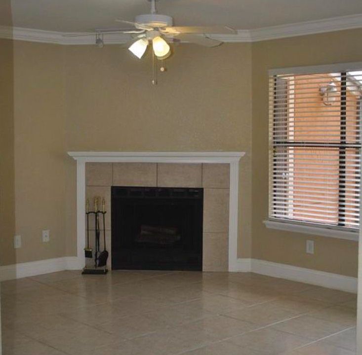 Wood burning fireplace in spacious living room