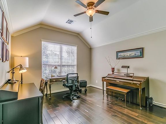 The large Study features arched ceilings, crown molding, and hard wood floors