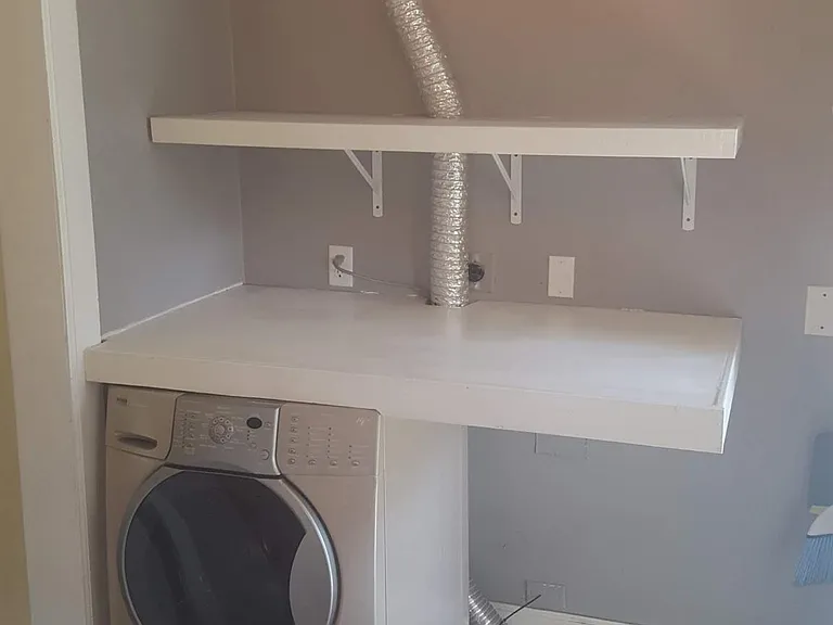 The Laundry area has a work surface already installed. Washer can be left for new tenant.