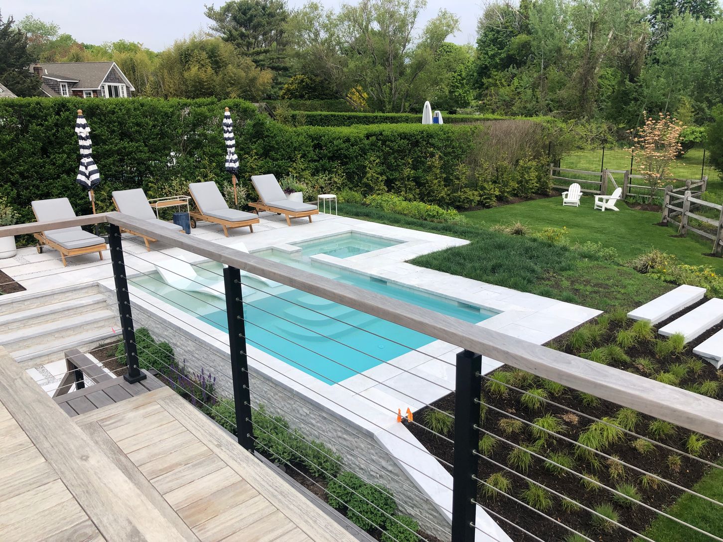  View of pool and backyard from the deck.