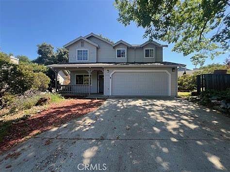 Front of House with Large Driveway