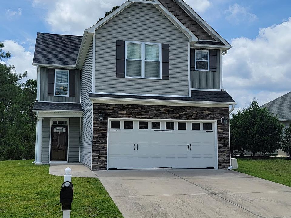 Front of home. Large 2 car Garage.