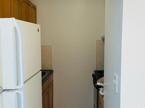 Kitchen on the left of the entrance