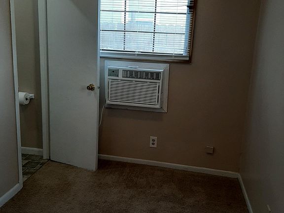 Bedroom looking to south, with entrance to bathroom
