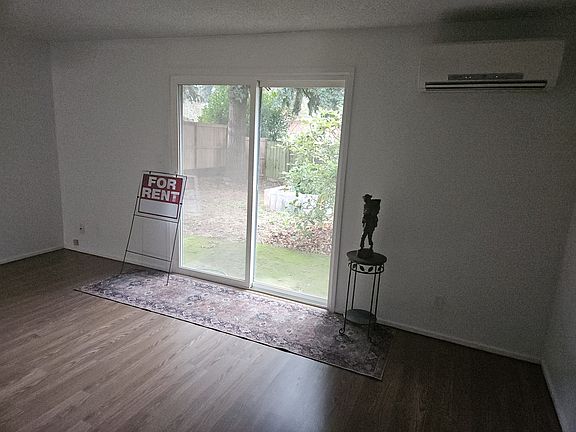 Living room has ductless AC/Heating Unit as well as ceiling heat through out