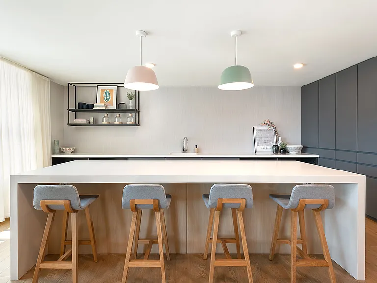 The community kitchen at Eleven33 blends sleek finishes and soft light the perfect spot to host, connect, or just enjoy a quiet morning coffee.