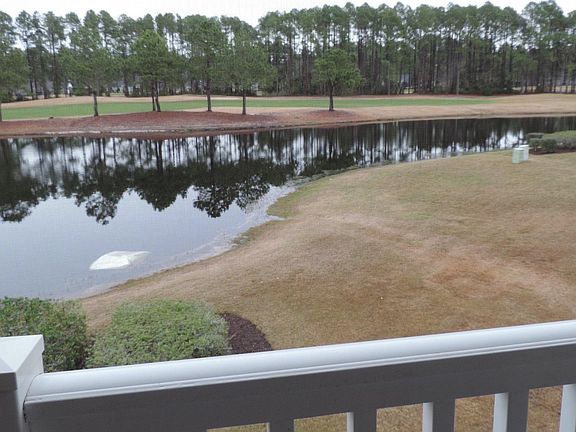 Golf course view from screened in porch
