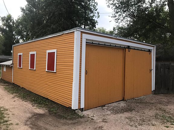 Deep, 2-car garage with additional storage space - side/front view