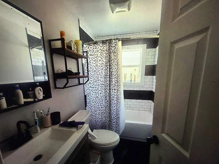 Conveniently located between the main-level bedrooms, this beautifully updated full bath features sleek, modern finishes and timeless style.